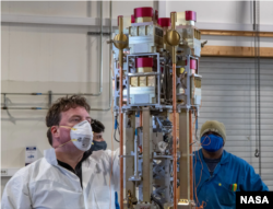 Glyn Collinson, NASA Endurance mission leader, examines an instrument used to confirm the existence of an ambipolar electric field during a rocket reassembly operation at a site in Svalbard, Norway. (Image credit: NASA Wallops/Brian Bonsteel)